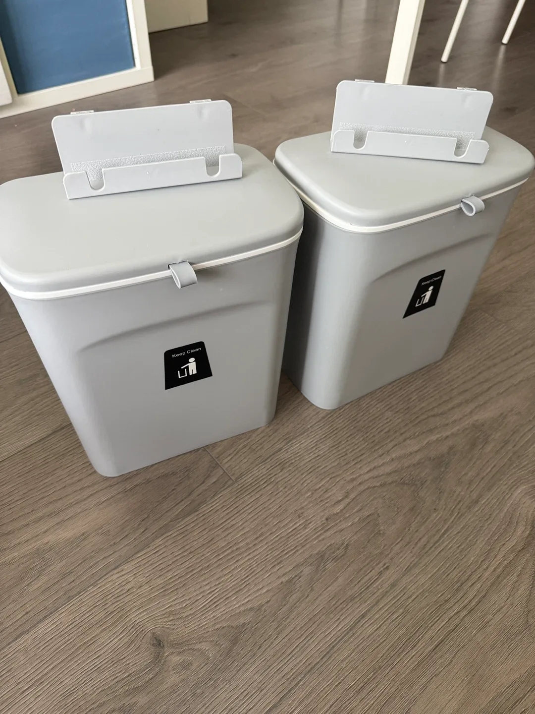 Two almost brand new trash cans