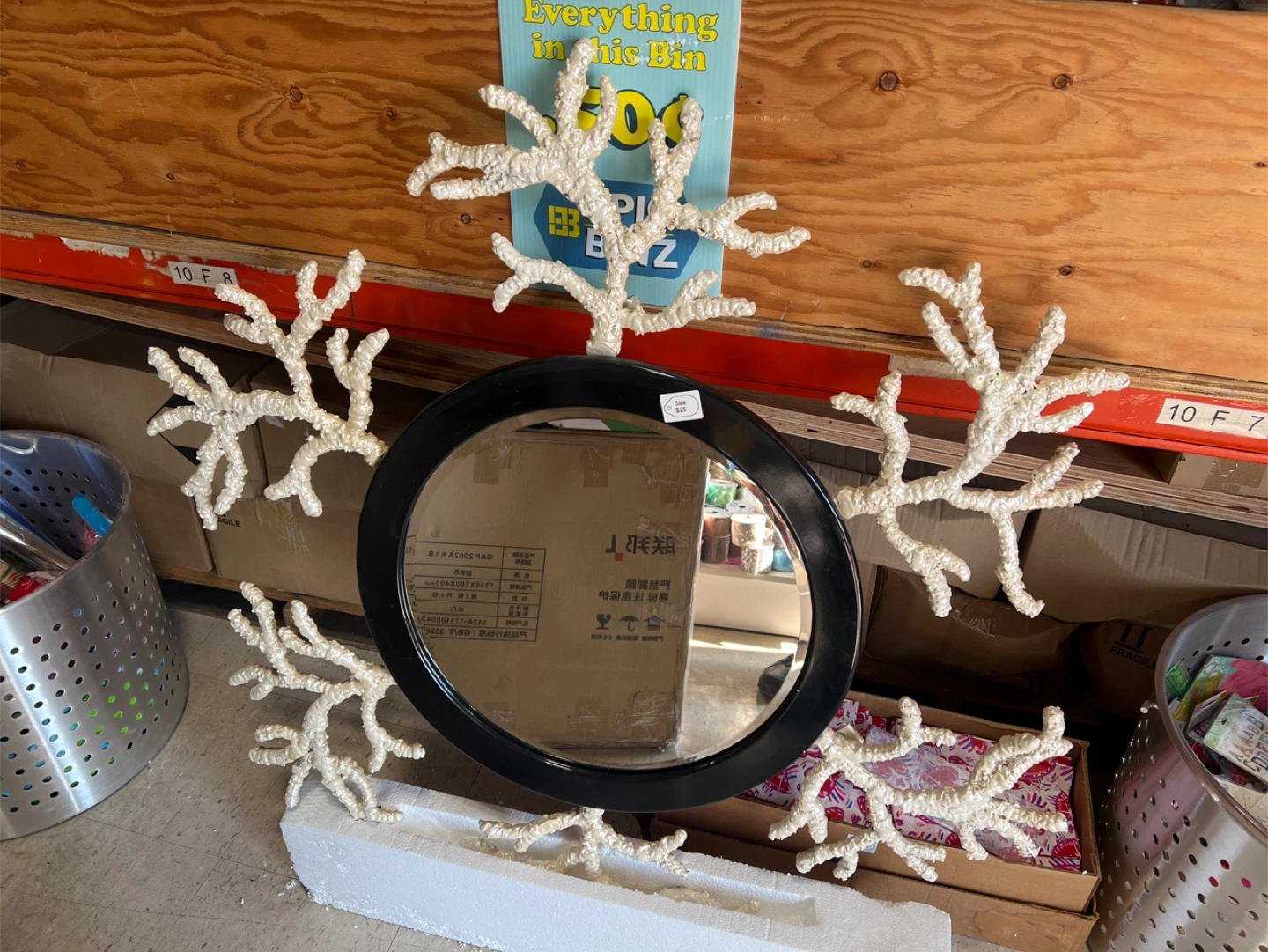 Round Black Framed Mirror with Coral Decor