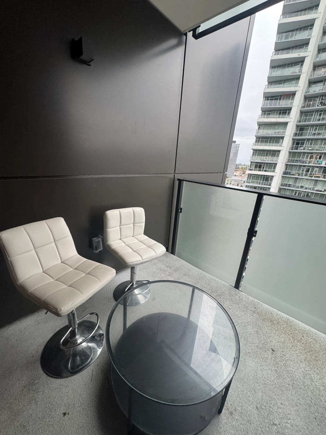 Two bar stools and a table