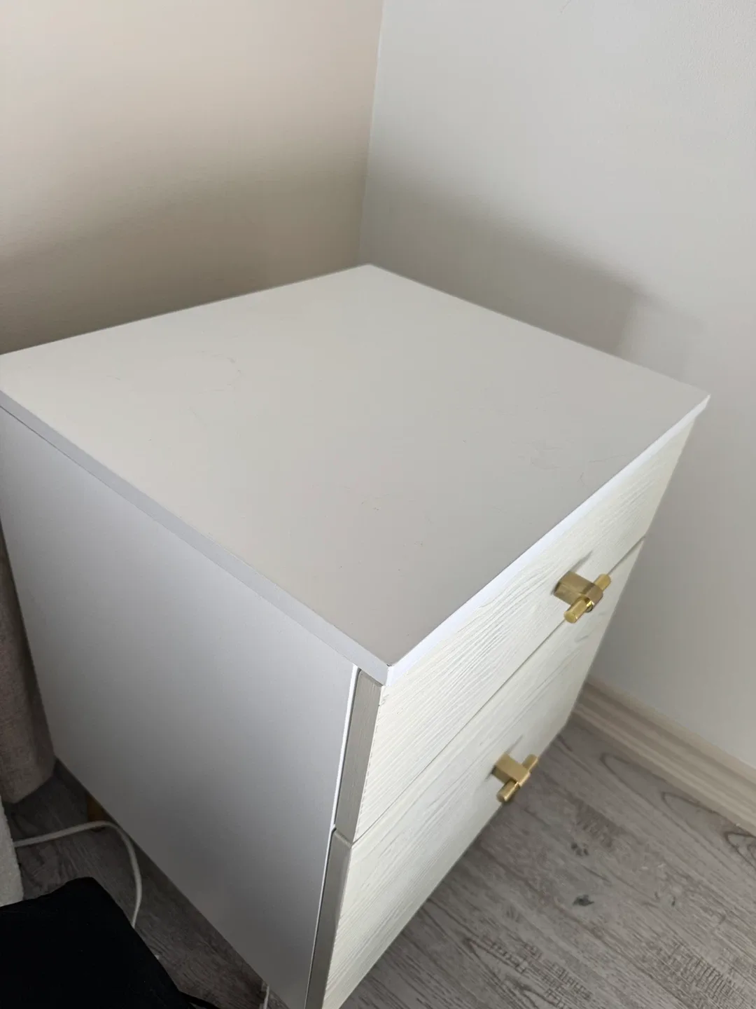 White Wood Grain Nightstand with Gold Accents image indicator(2)