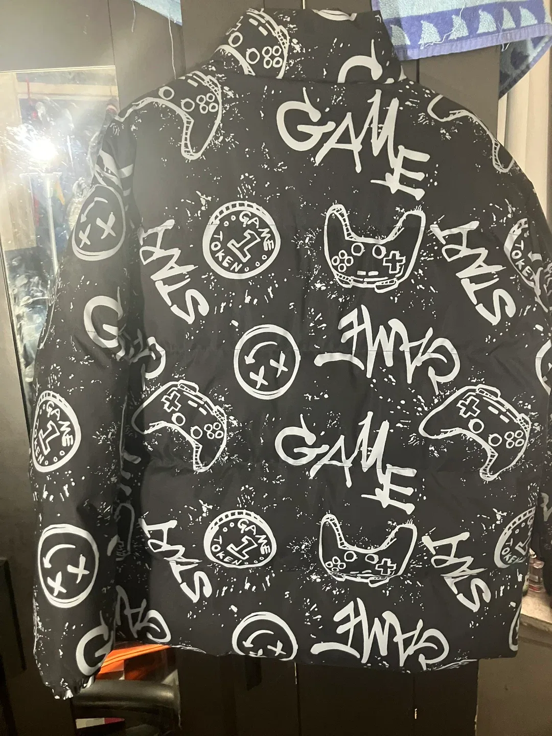 Black Puffer Jacket with Game Controller Print image indicator(8)