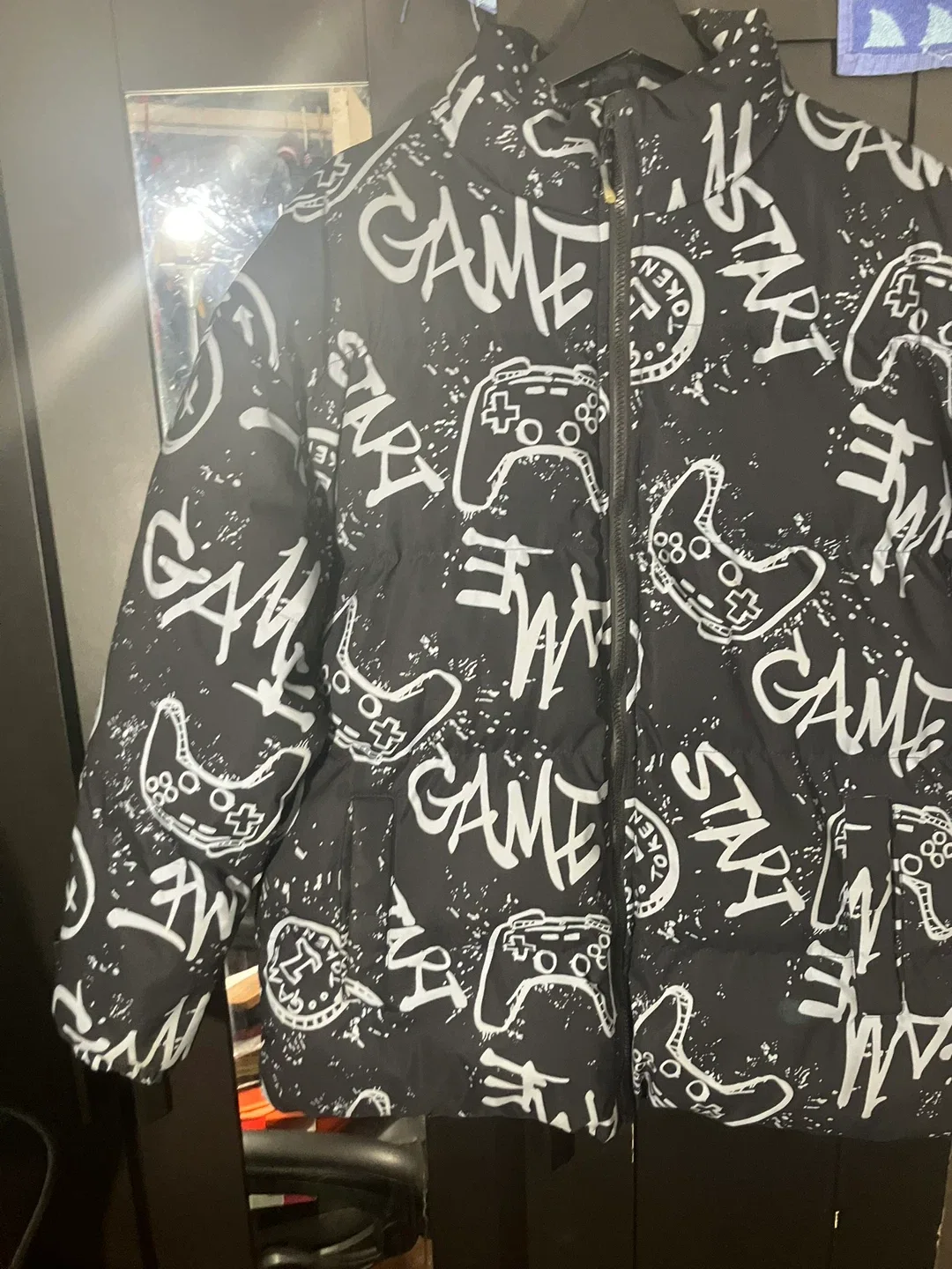 Black Puffer Jacket with Game Controller Print image indicator(9)