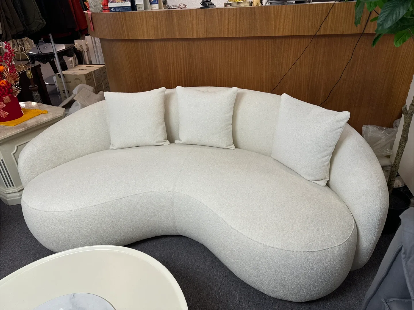White Curved Sofa with Pillows thumbnail