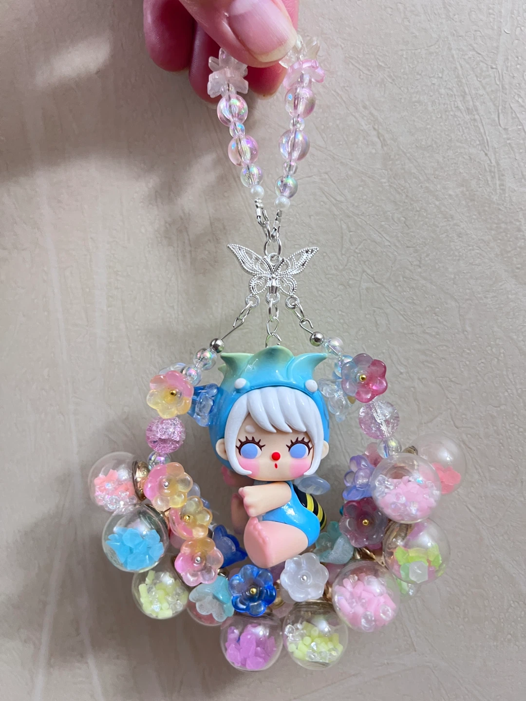 Luminous flower ball with cute baby doll pendant