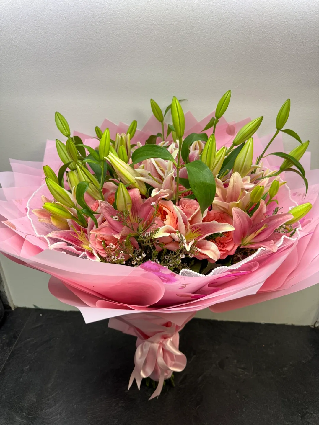Pink lilies bouquet and roses. image indicator(3)