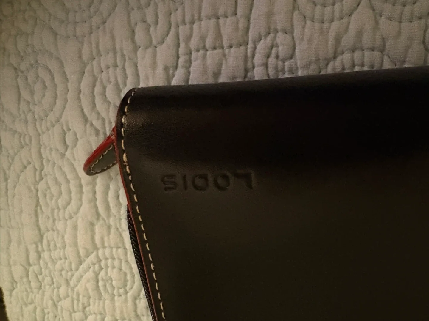 New black faux leather wallet. Red interior