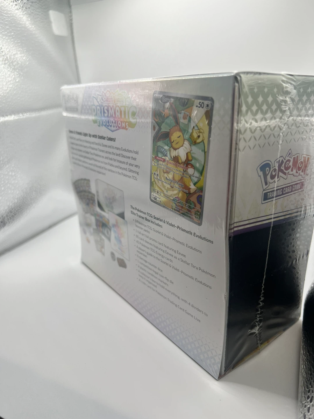 Pokémon Prismatic Eevee ETB - Damage to Shrink Wrap Only - photo 3