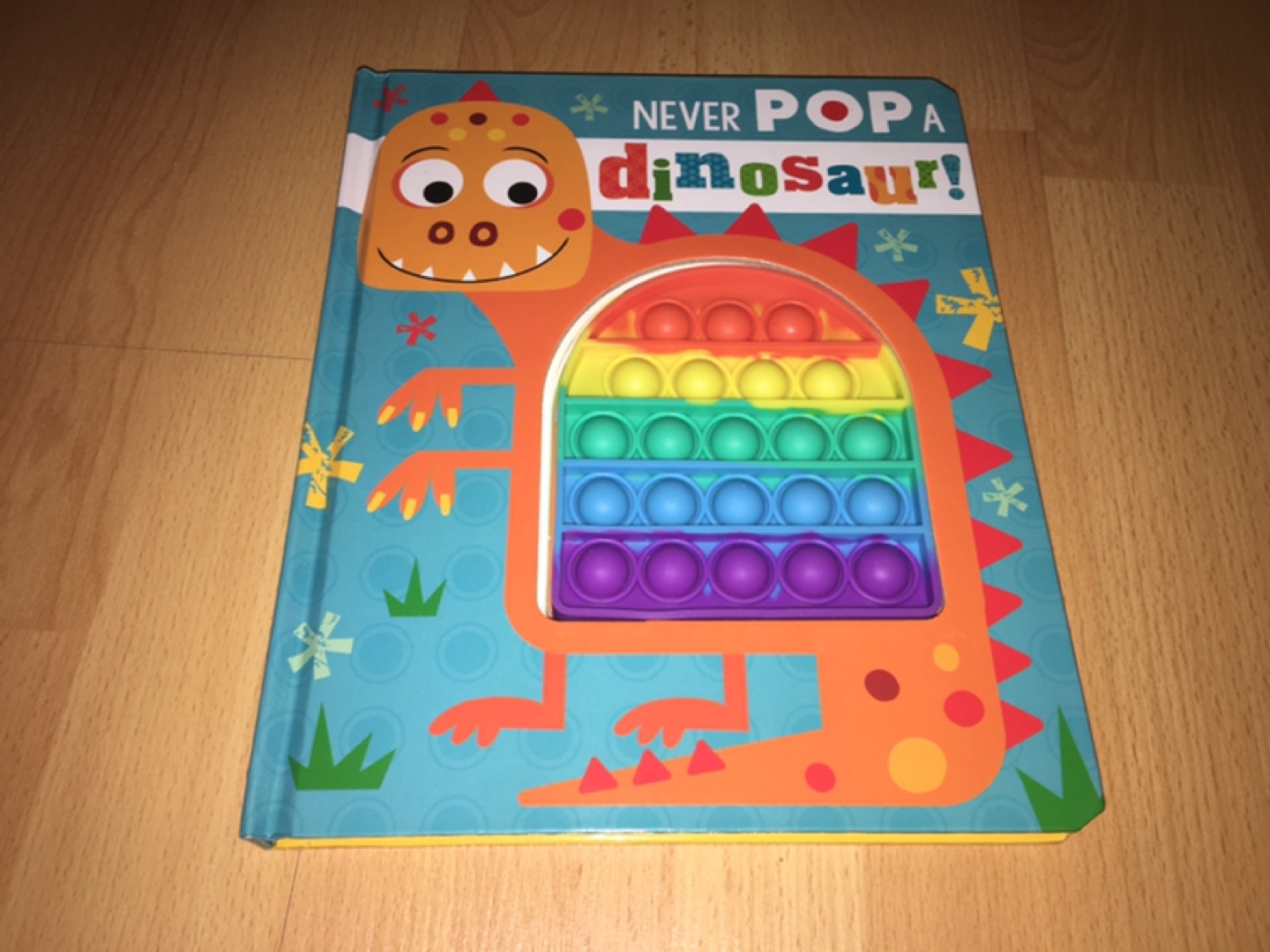 Never Pop A Dinosaur! Book with Sensory Pop-Its