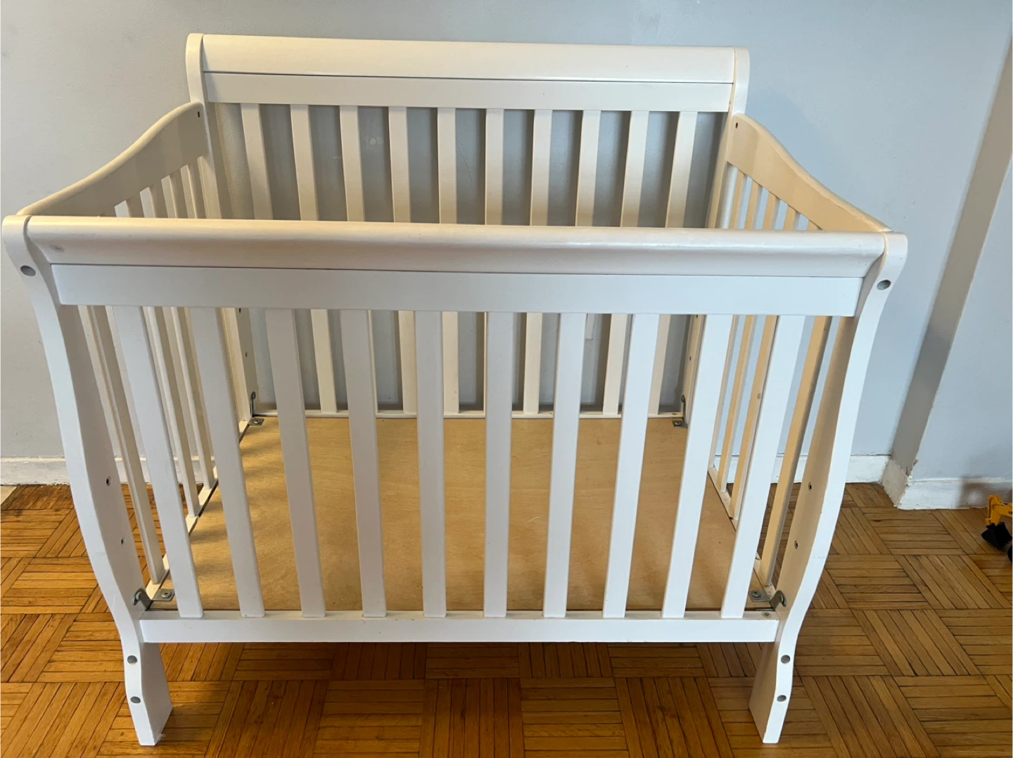 White mini Baby Crib Dimensions: L 39 H 38 W 25 inches