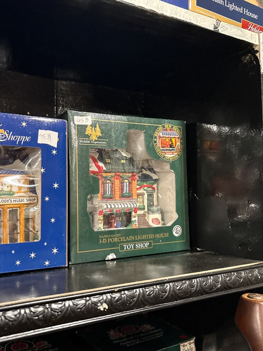 Holiday Expressions 3-D Porcelain Lighted House Toy Shop image indicator(3)