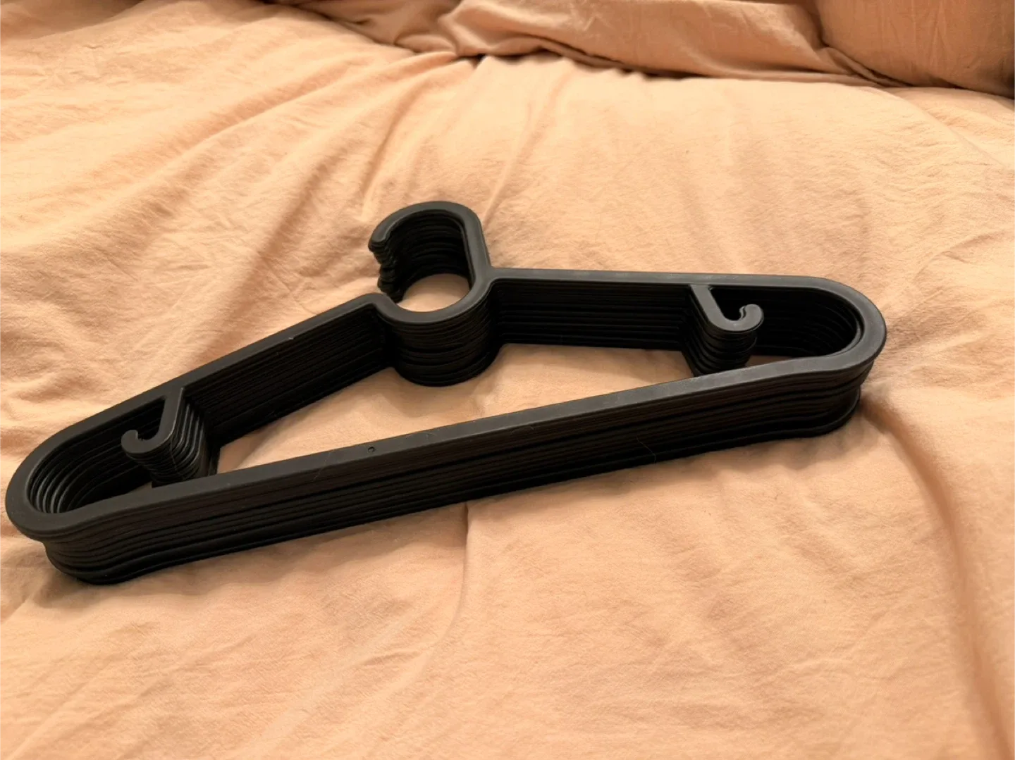 A set of 12 Black Clothes Hangers image indicator(3)