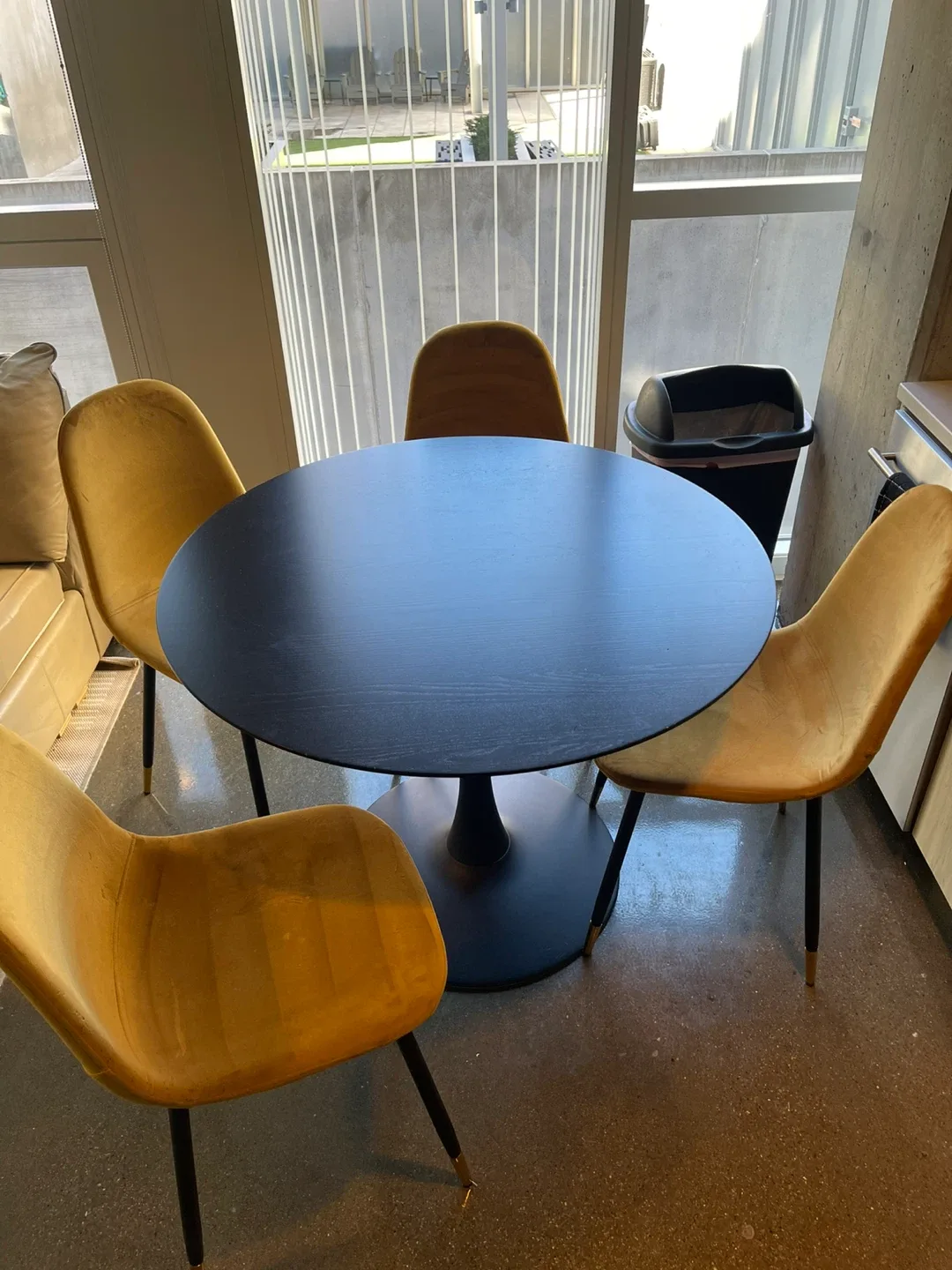 Round Black Dining Table with 4 Yellow Chairs image indicator(2)