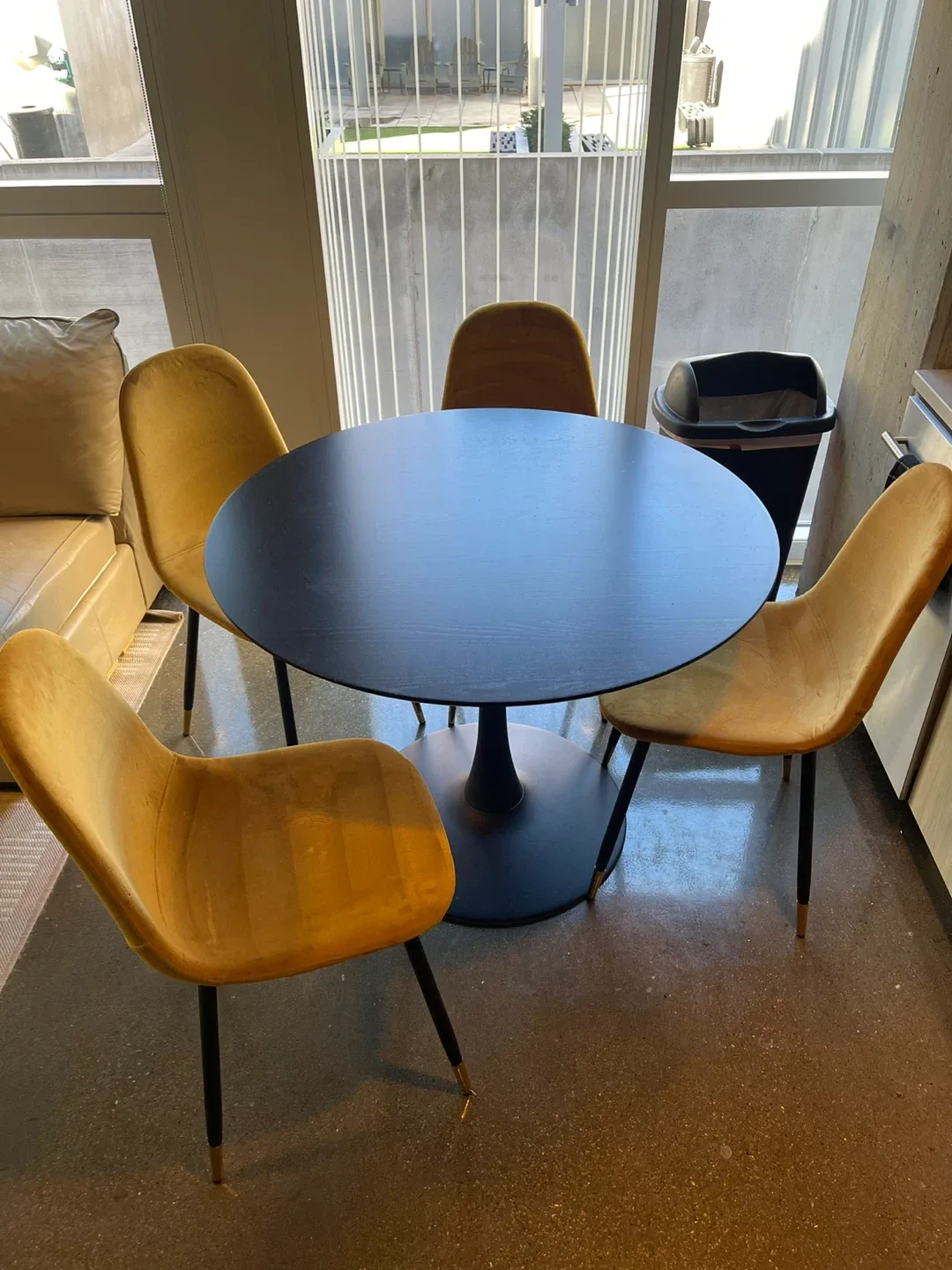 Round Black Dining Table with 4 Yellow Chairs image indicator(3)