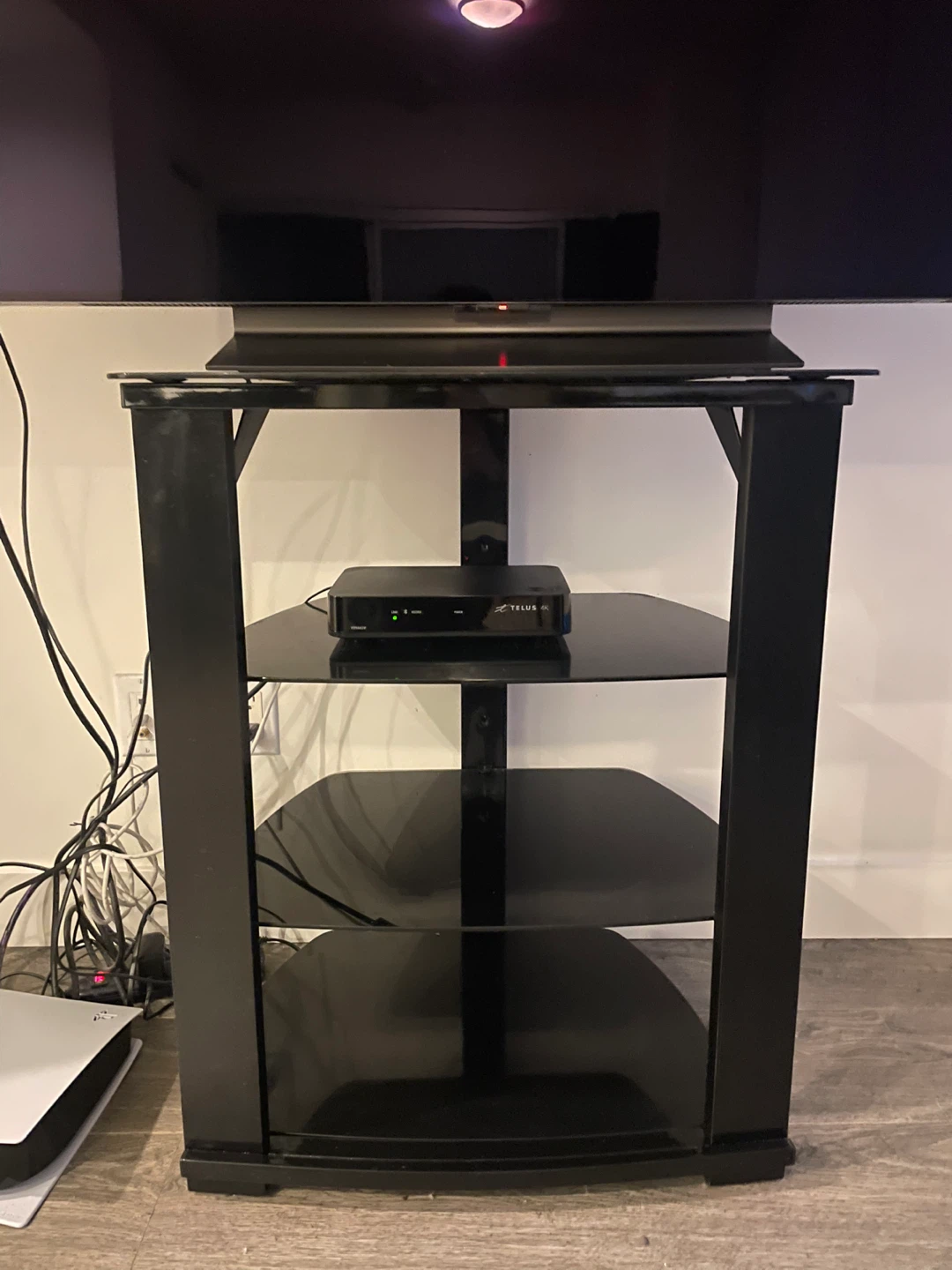 Black tv/media stand with black glass shelves