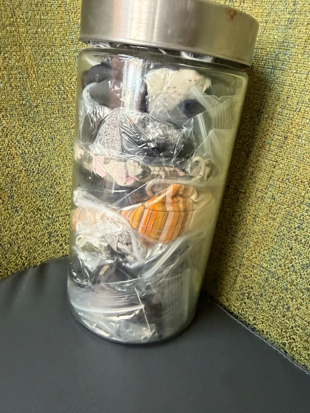 Selling a jar full of various cotton masks. image indicator(10)