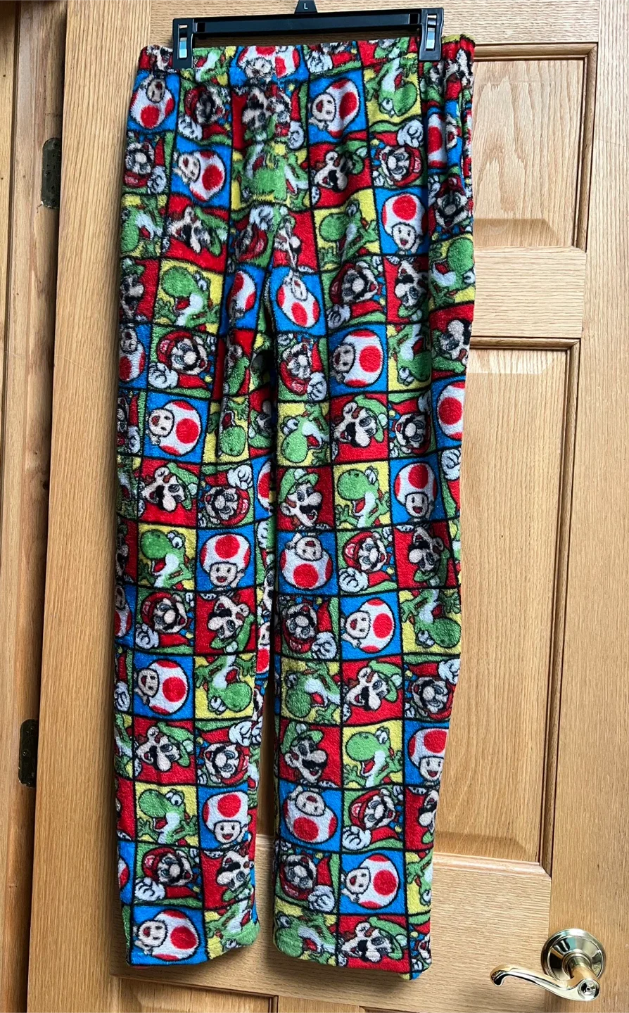 Super Mario pajama pants with an all-over character grid print.