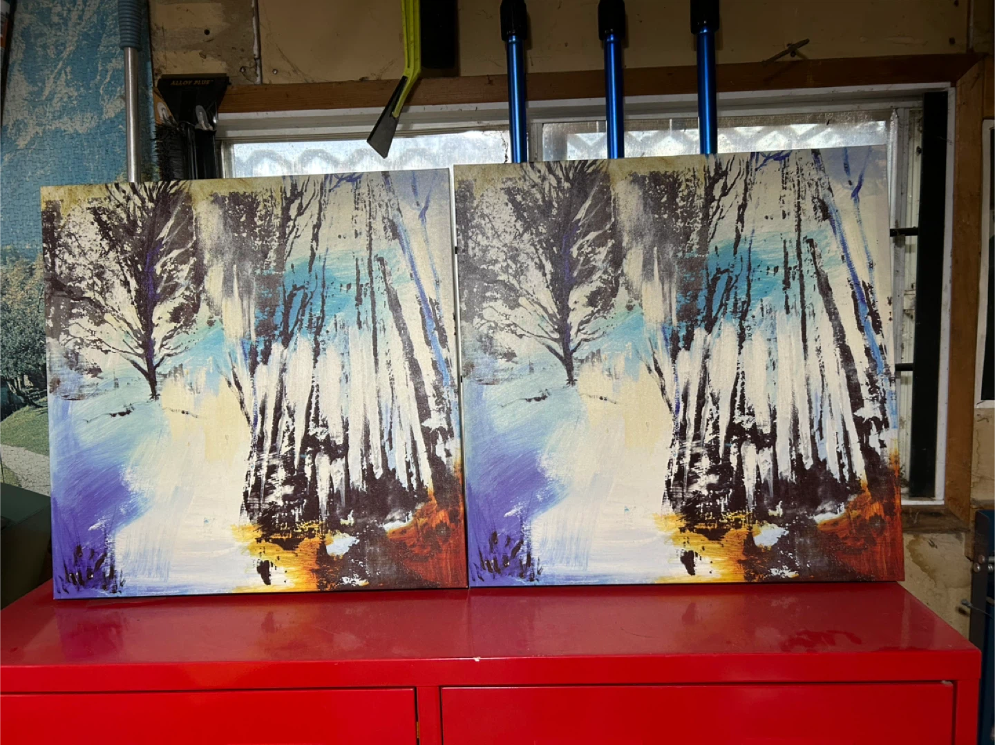 Two forest scene paintings