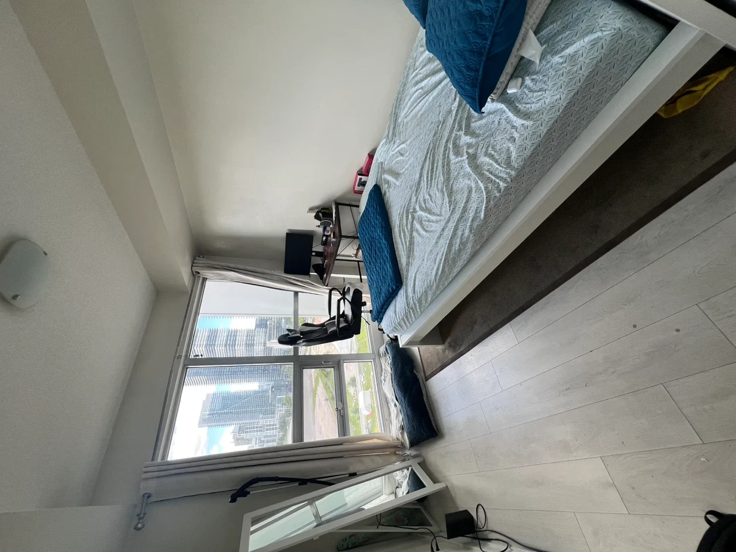 Bed frame with mattress and pillows