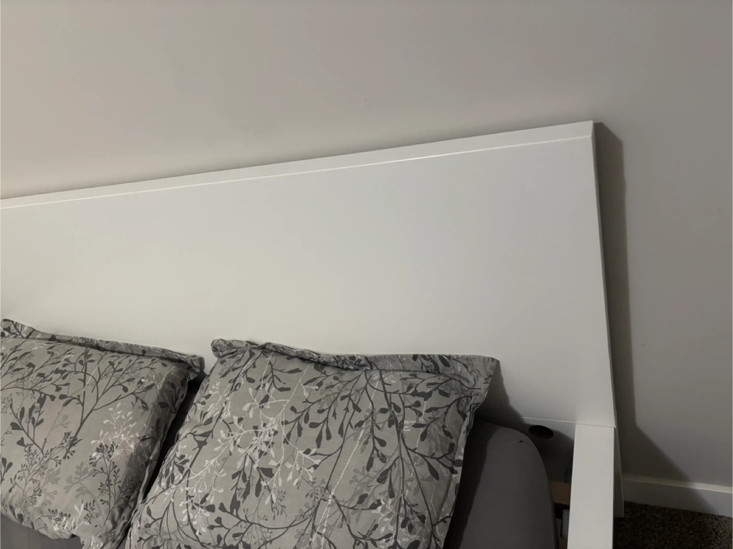 White Bed Frame with Grey Bedding & Floral Pillows - photo 3