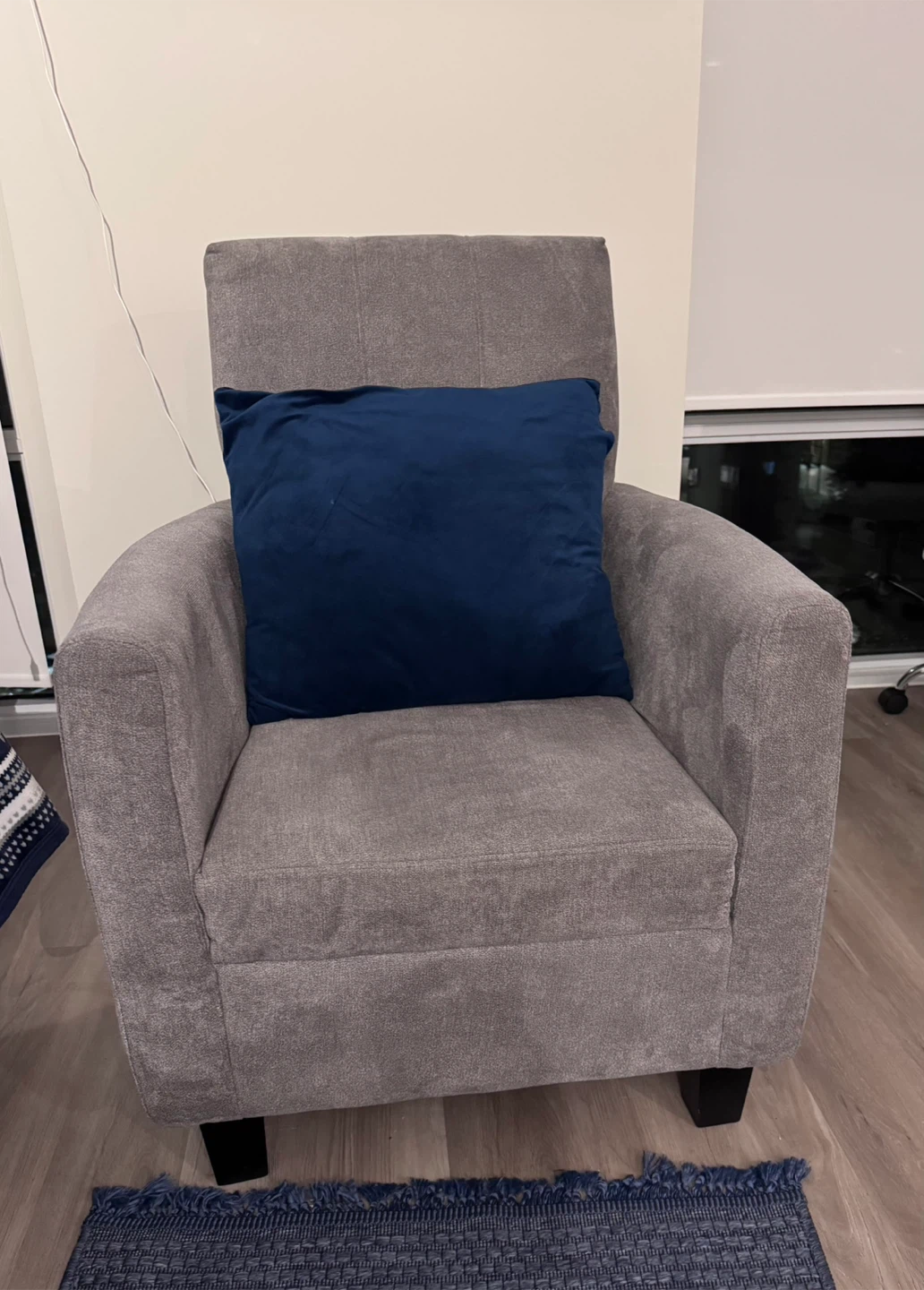 Grey Armchair with Blue Pillow