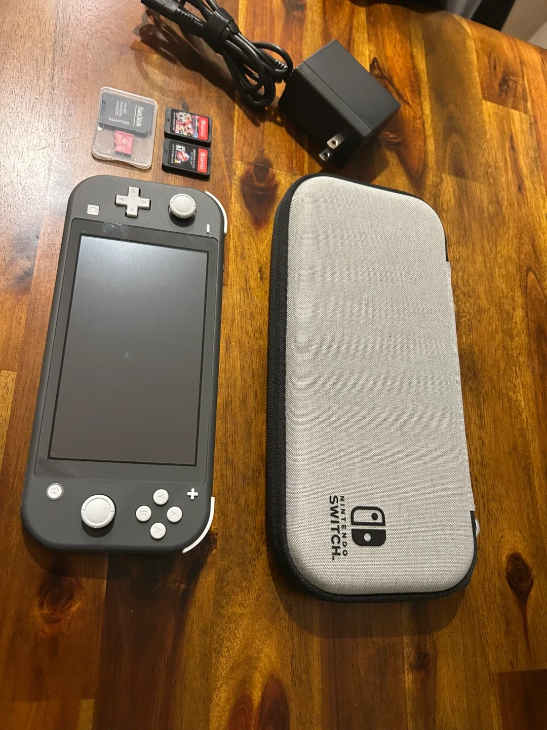 Nintendo Switch Lite (Grey) with Case & Games image indicator(8)
