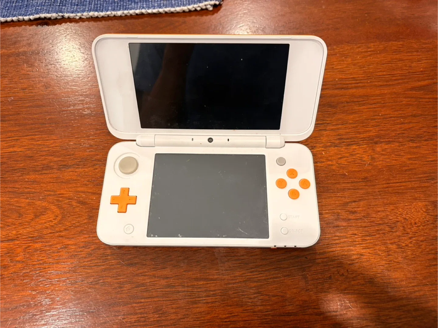 Nintendo 2DS handheld console with charger image indicator(4)