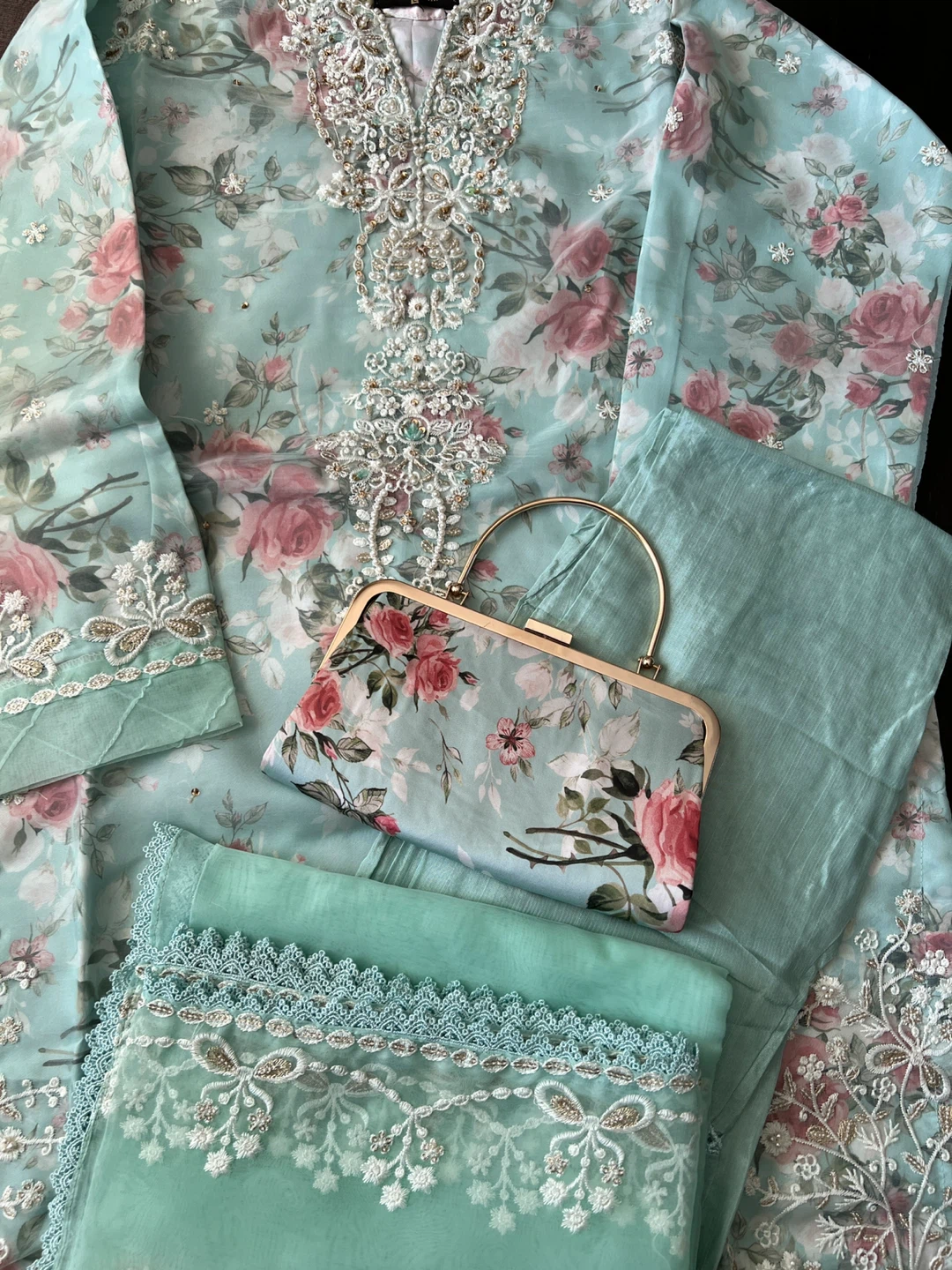 Beautiful Turquoise colour fancy embroidered organza suit