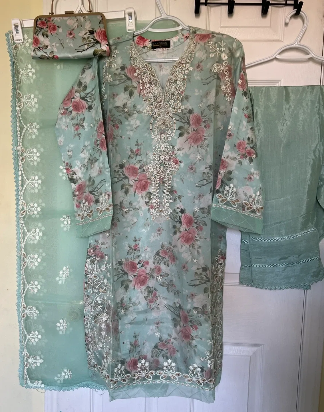 Beautiful Turquoise colour fancy embroidered organza suit image indicator(3)