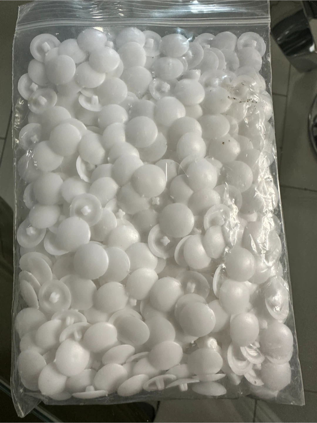 Bag of White Screw Cover Caps