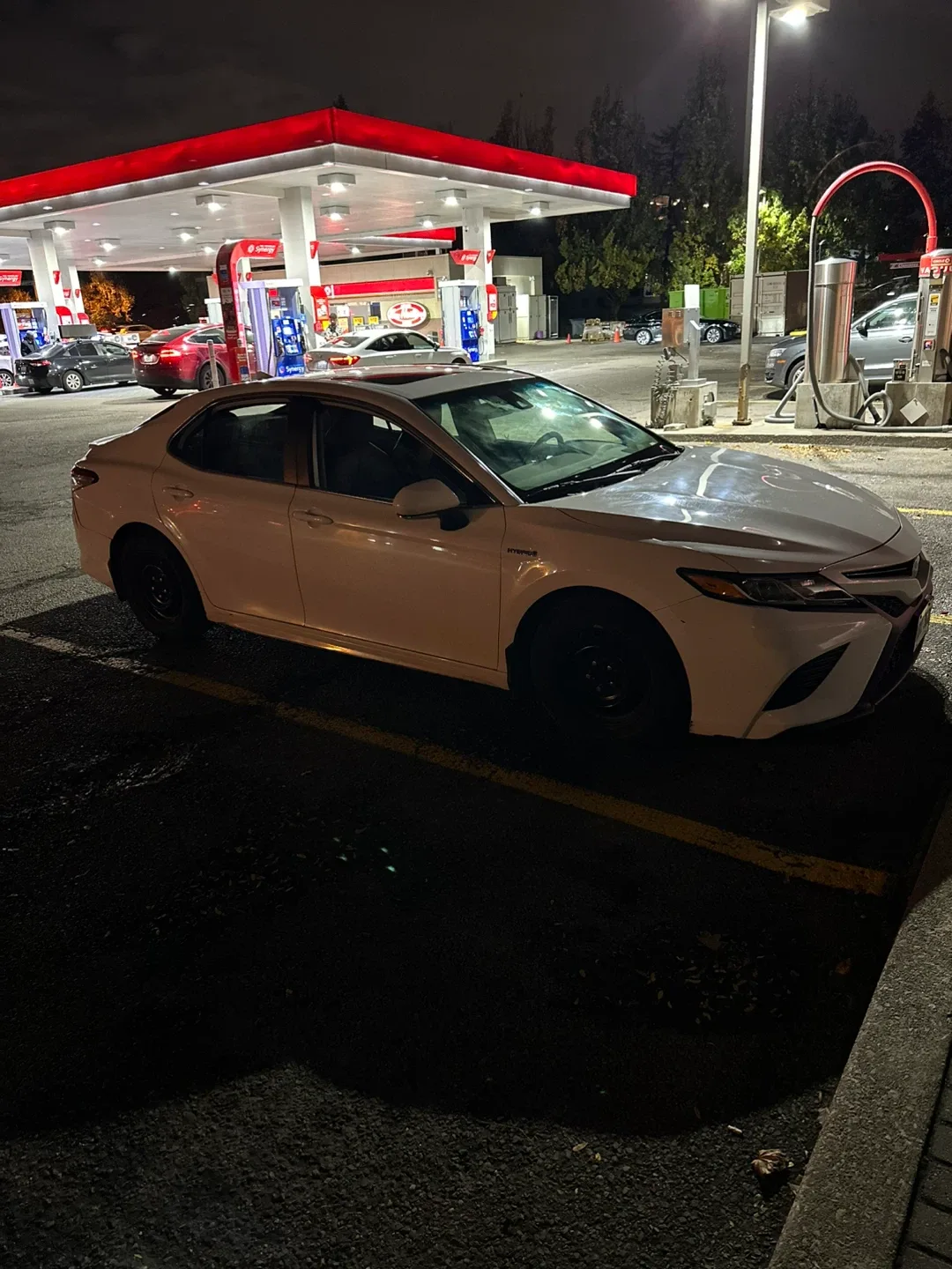 Toyota Camry Hybrid - White Sedan