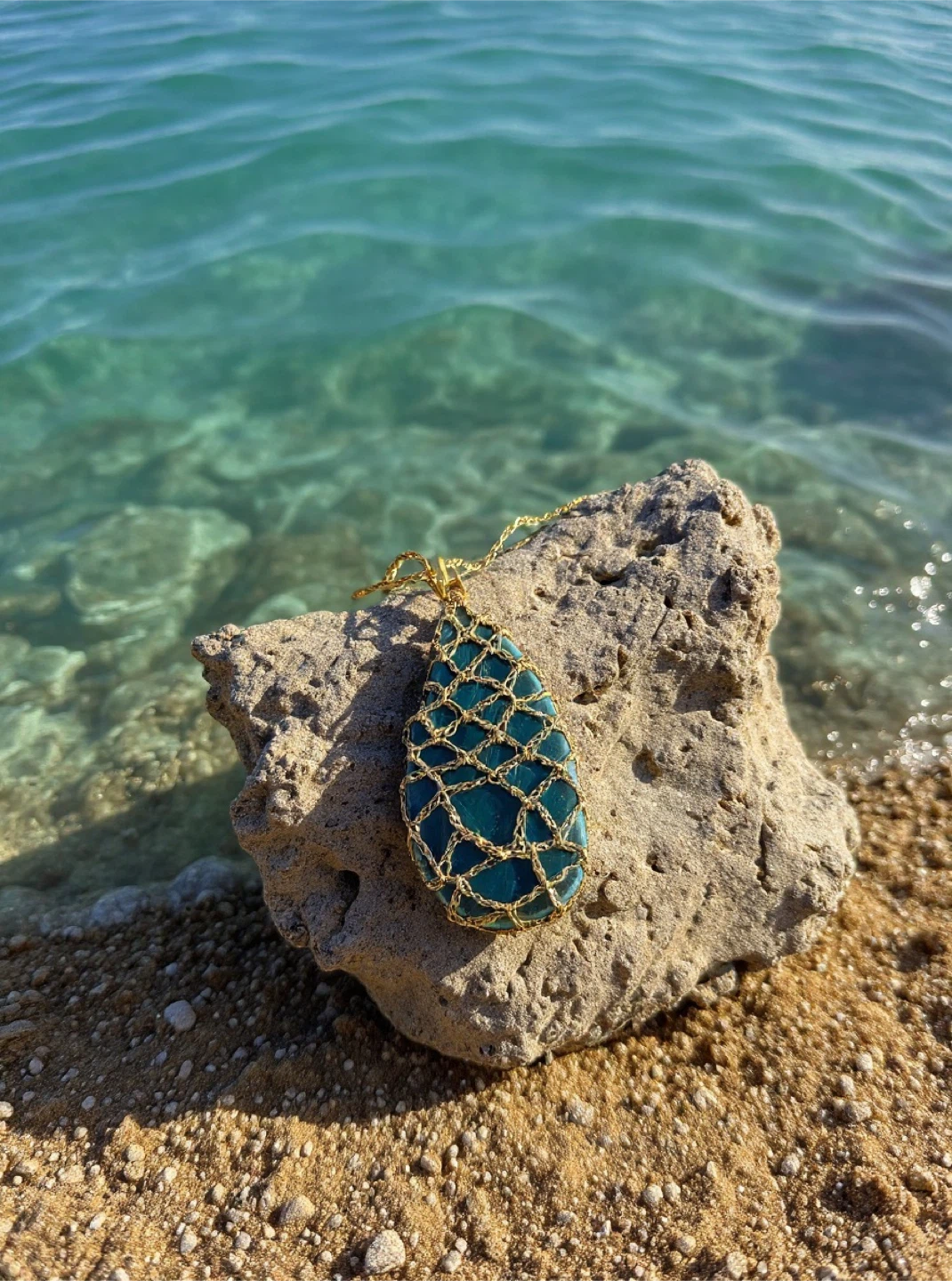 Handmade crocheted amulet with blue Brazilian Agate