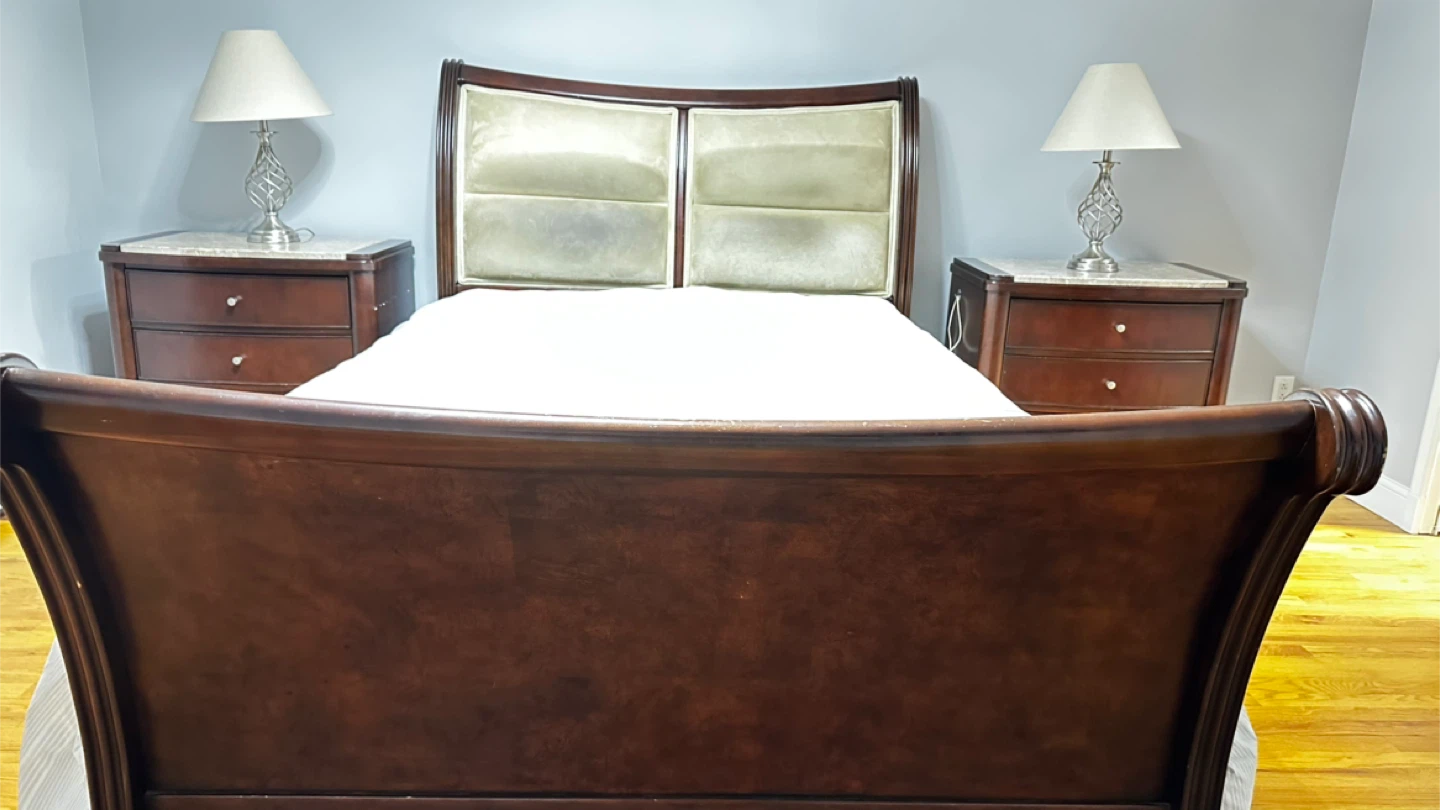 Queen bed with a Pair of Brown Nightstands with Marble Top