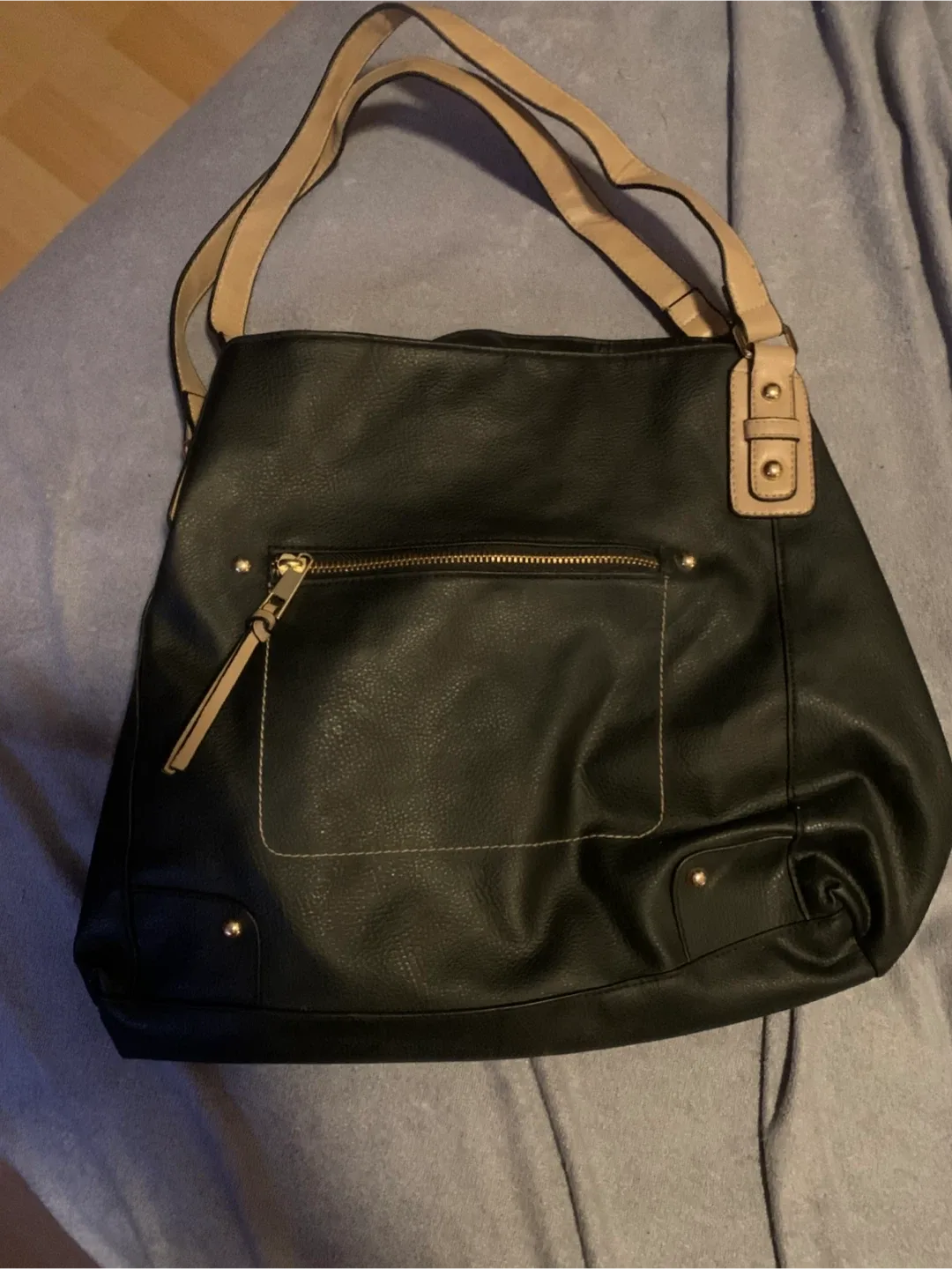 Black handbag with tan straps