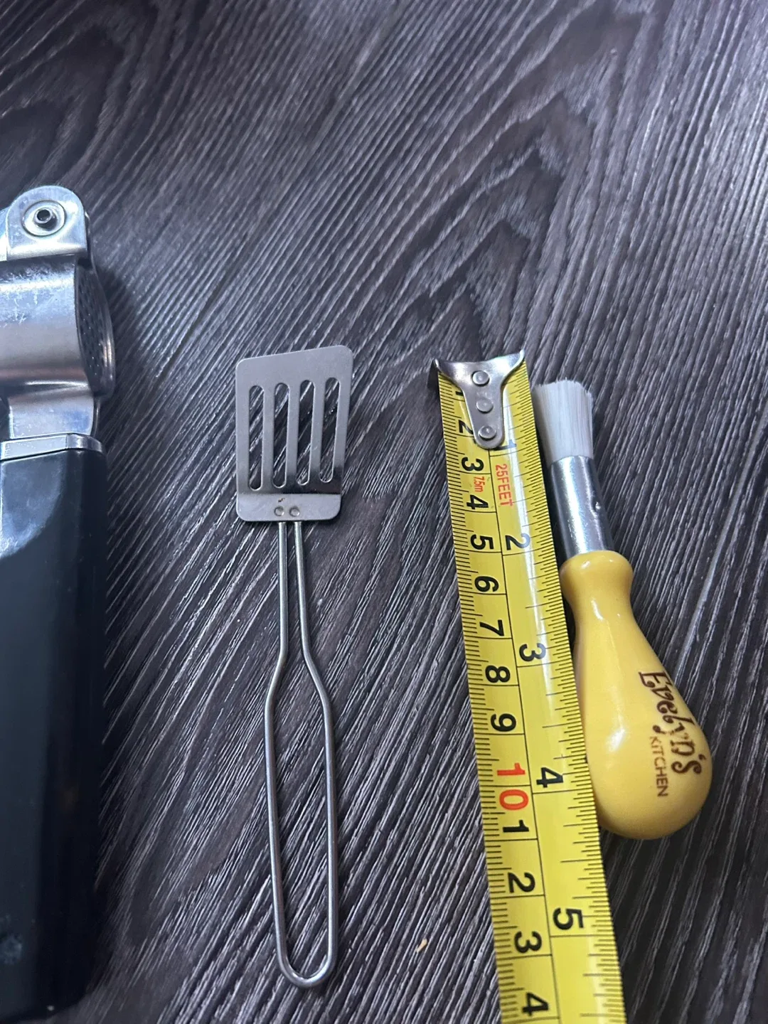 Garlic press ,cheese cutter small spatula and brush image indicator(5)