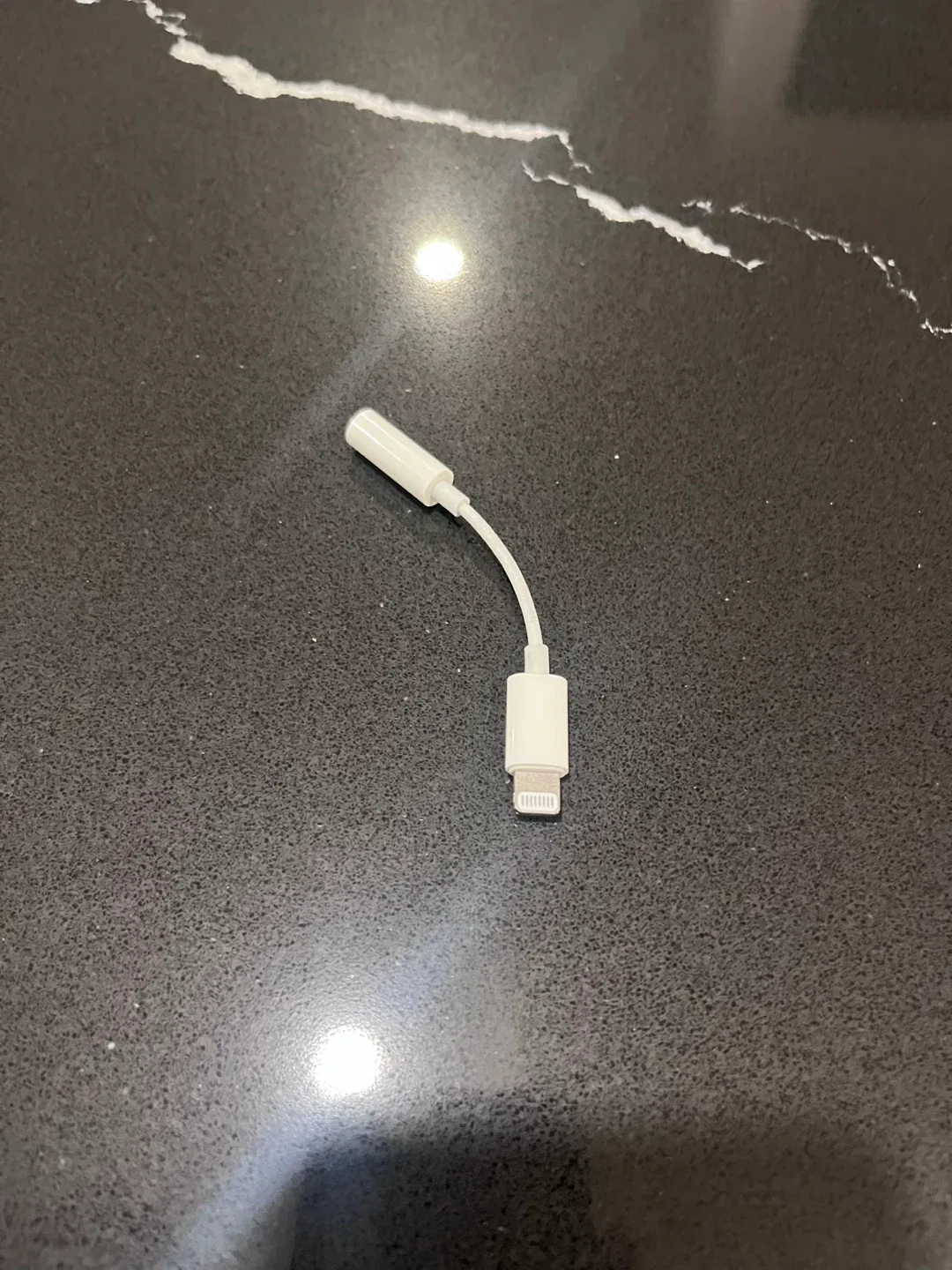 Apple Lightning to 3.5 mm Headphone Jack Adapter. image indicator(2)