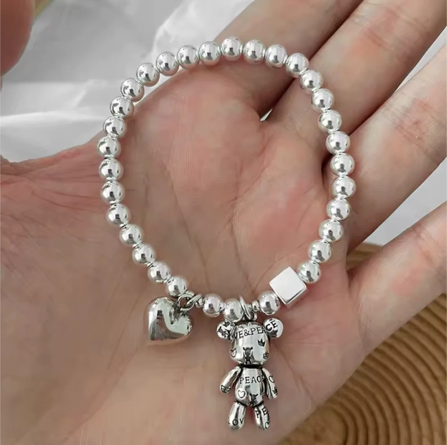 Silver plated Beaded Bracelet with Heart and Bear Charms