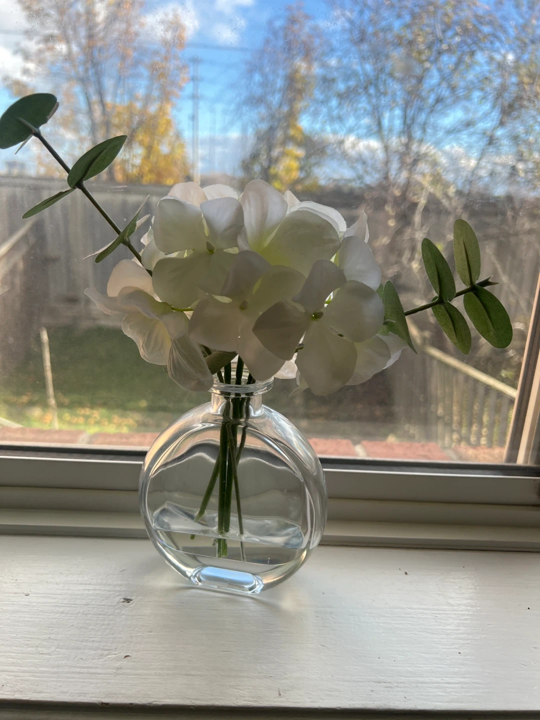 Clear Round Vase with White Flowers