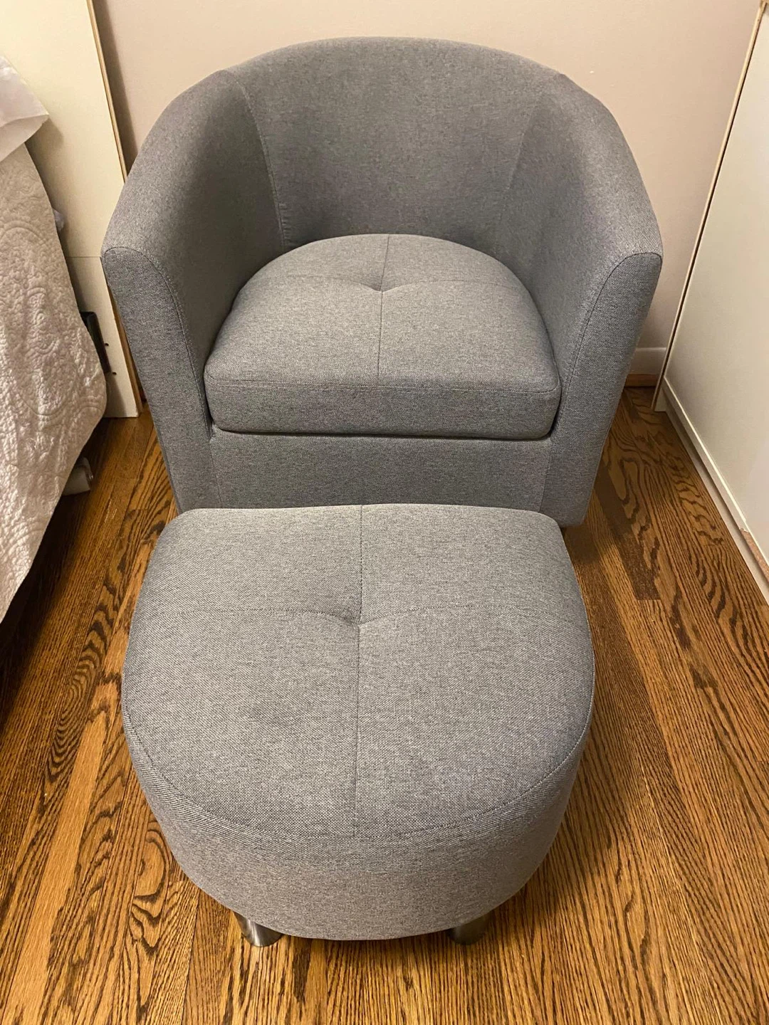 Grey fabric chair with ottoman