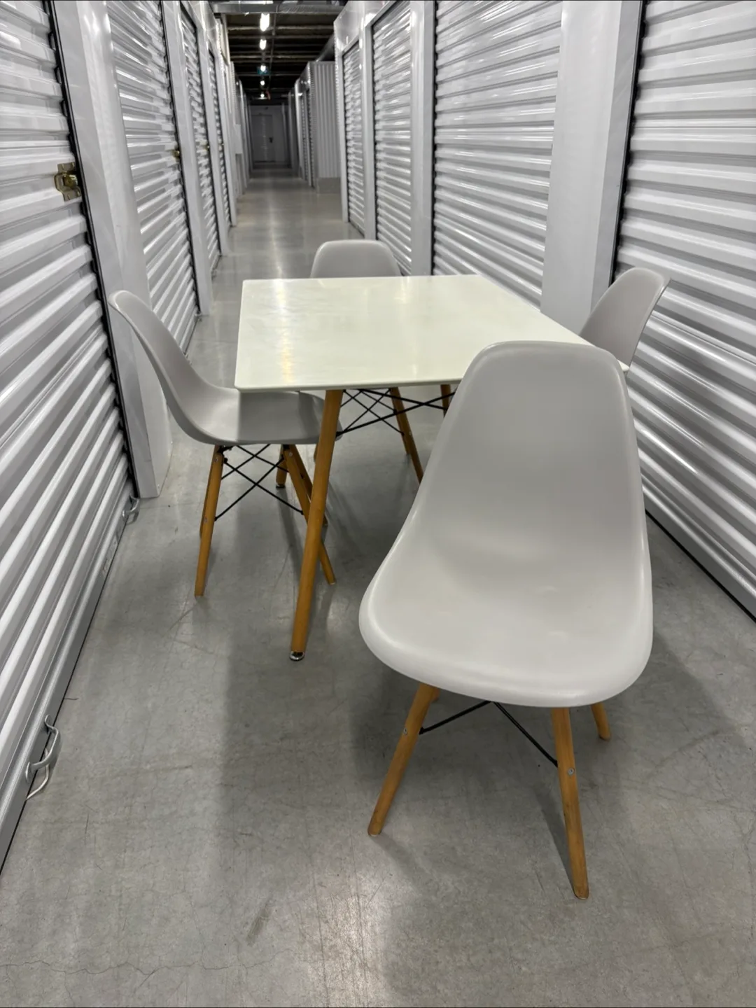 Can deliver—White Eiffel Table and 4 light grey chairs.