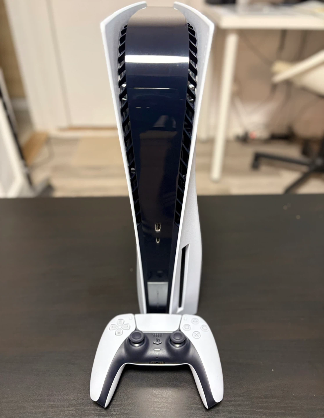 PlayStation 5 with Controller and God of War PS4