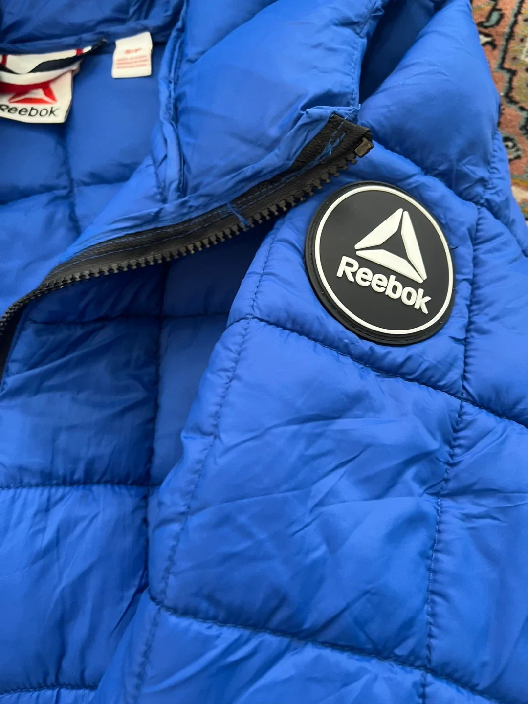 Brand new with tag Reebok Blue Puffer Jacket image indicator(7)