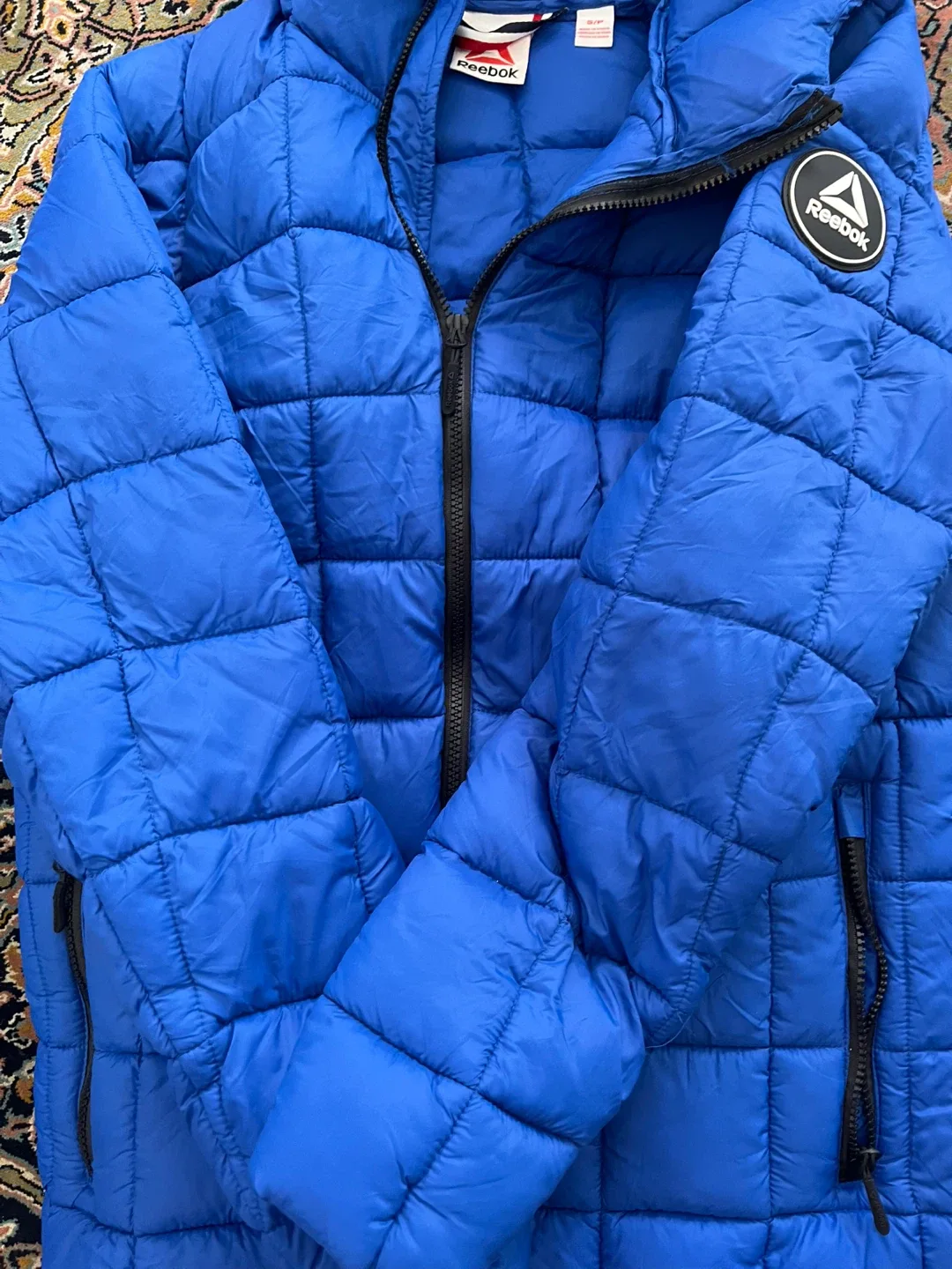 Brand new with tag Reebok Blue Puffer Jacket image indicator(9)
