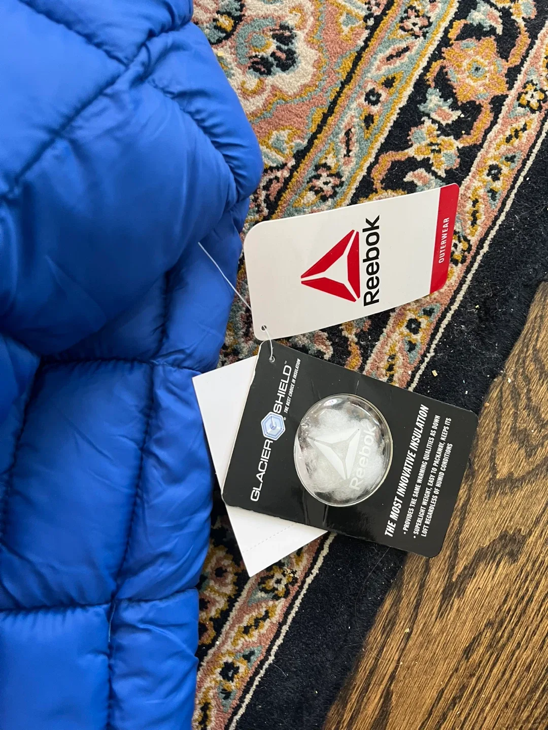 Brand new with tag Reebok Blue Puffer Jacket image indicator(8)