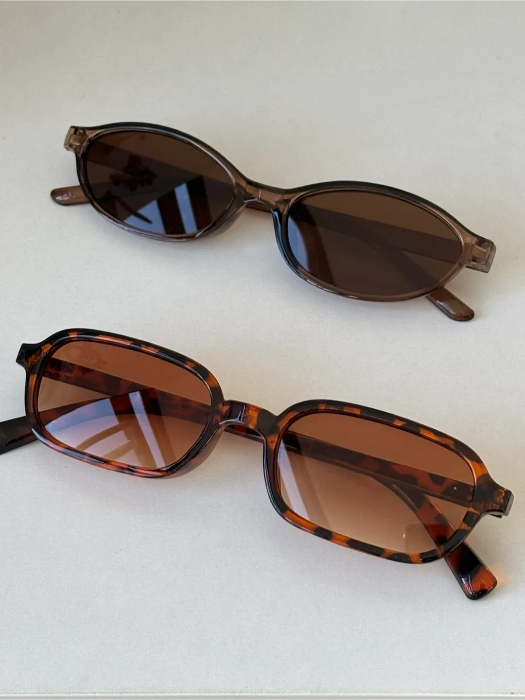 Two Pairs of Sunglasses