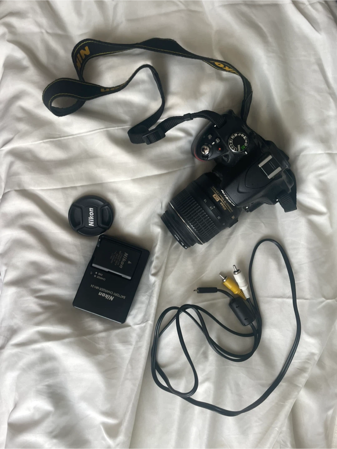 Nikon D5100 DSLR camera with 18-55mm lens + carrying case