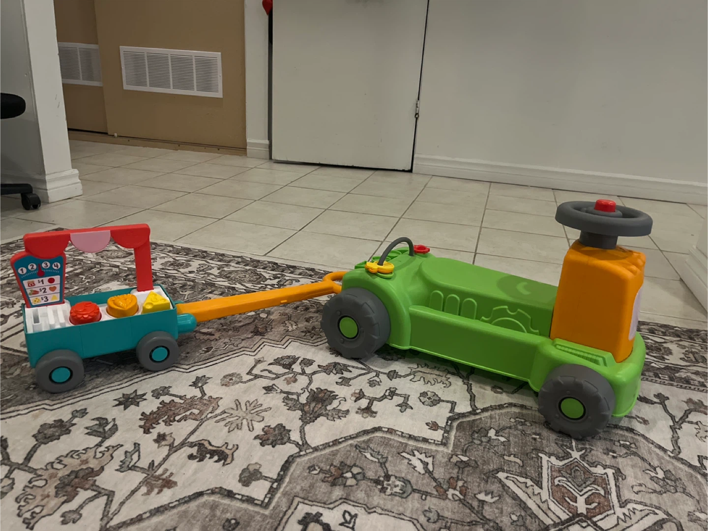Fisher-Price Tractor Ride-On Toy with Wagon