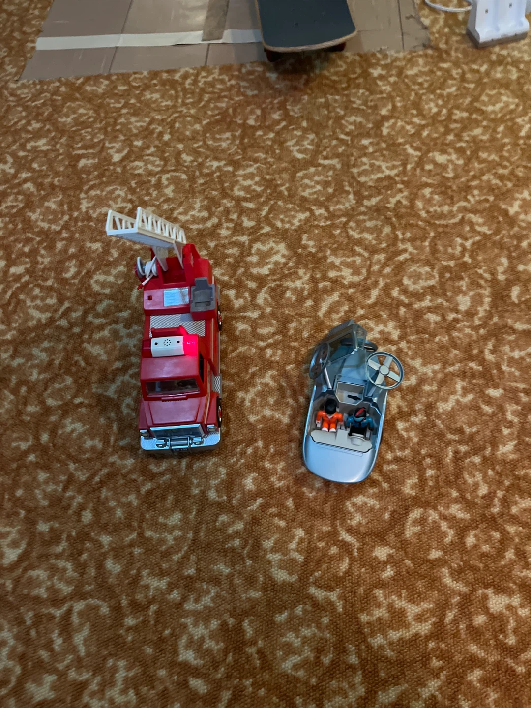 Toy fire truck and a toy Roblox jail brake car