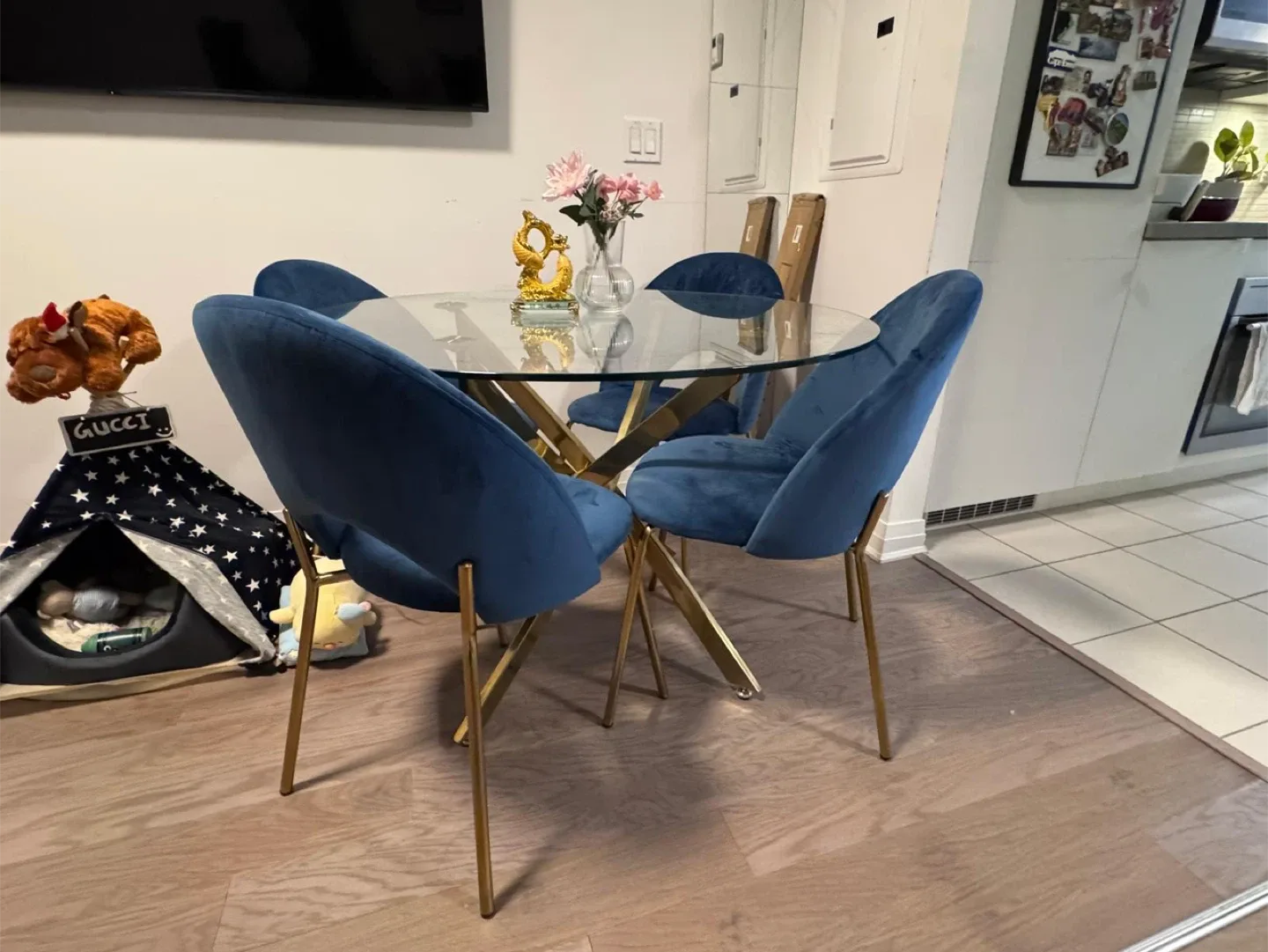 Round Glass Dining Table with 4 Blue Velvet Chairs