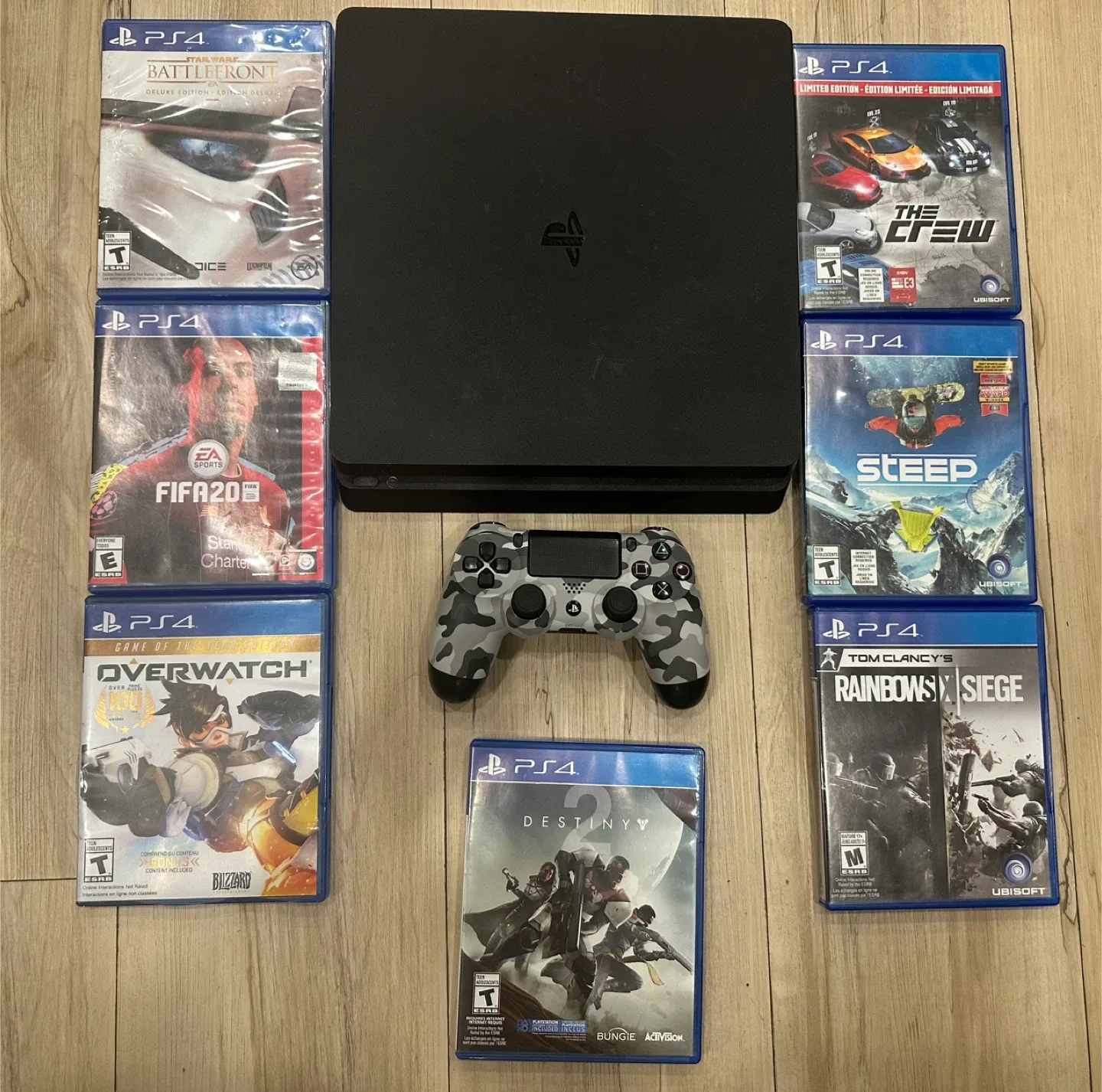 PlayStation 4 with Controller and 7 Games image indicator(3)