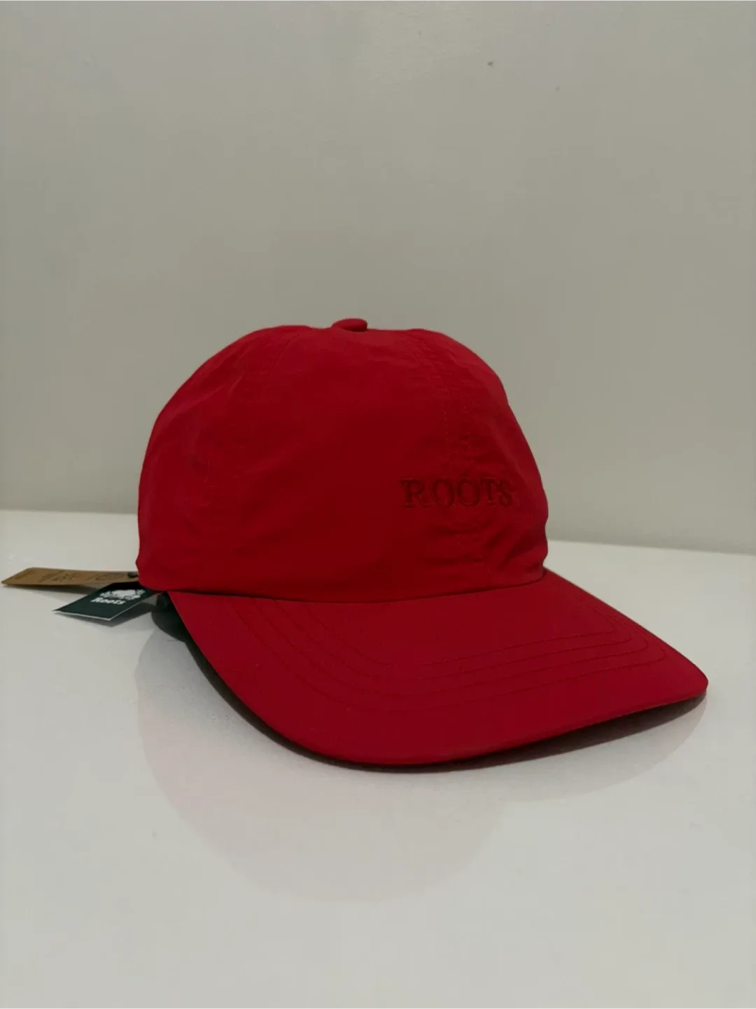 Roots Canada nylon cap red brand new with tags